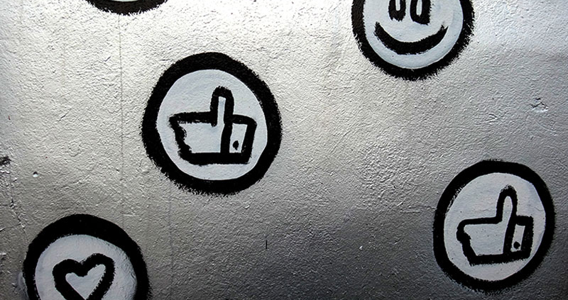 Social media icons painted on a silver metallic surface
