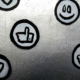 Social media icons painted on a silver metallic surface