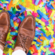 Man standing on confetti filled floor