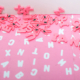 Magnetic pink letters piled together